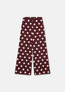 Pantalon Positivo bordeaux imprimé coeurs blancs