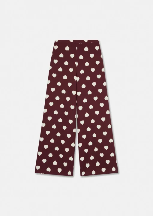 Pantalon Positivo bordeaux imprimé coeurs blancs